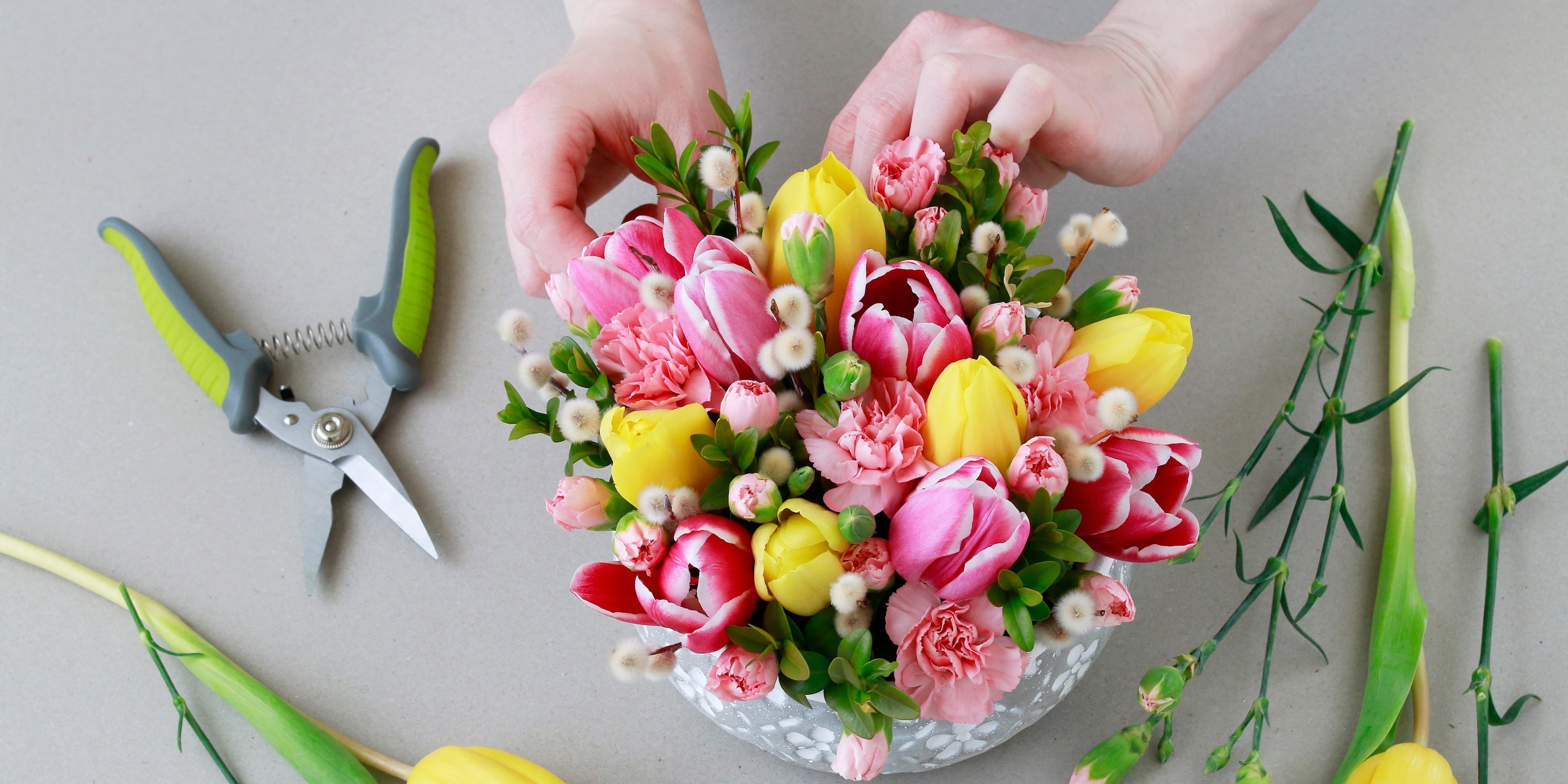 Women-owned florist arranging fresh flowers in Ukraine shop