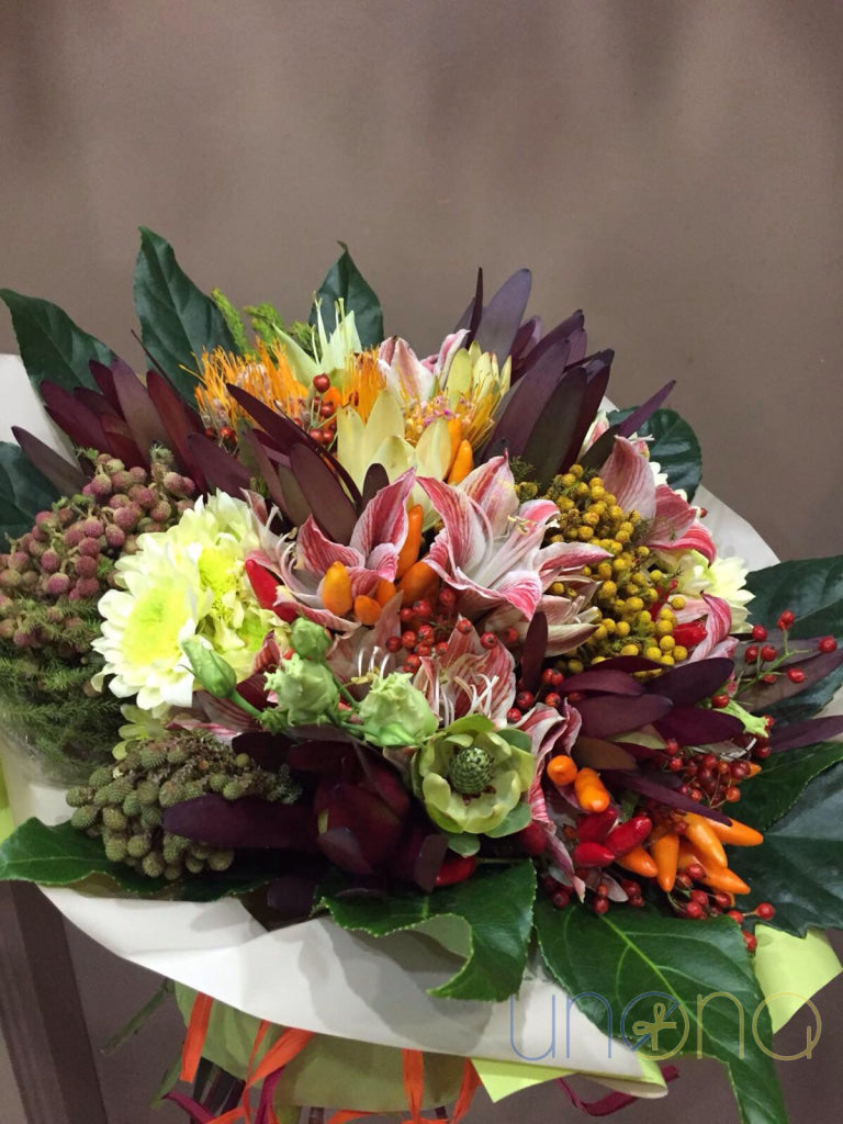 Chrysanthemums and sunflower in a colorful autumn bouquet