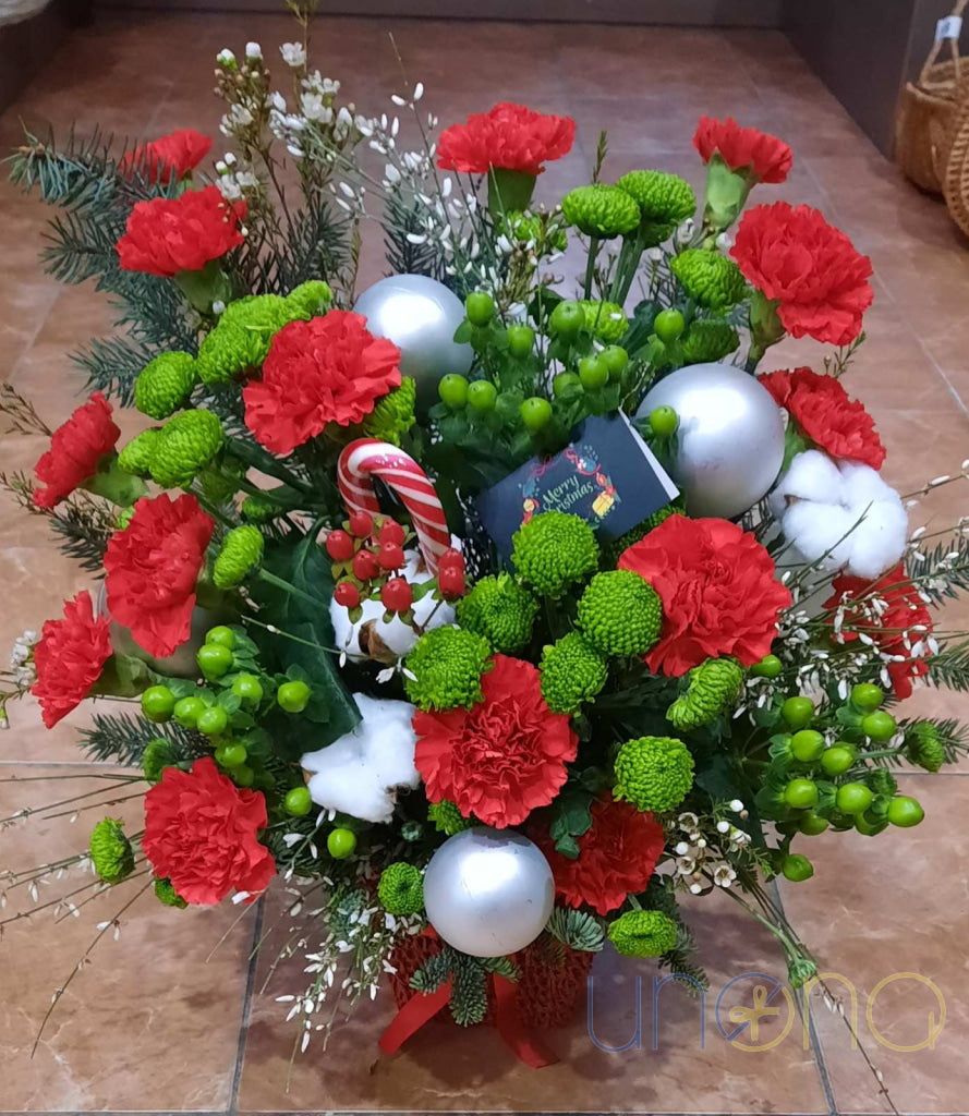 Festive Christmas flower arrangement in red, white and green