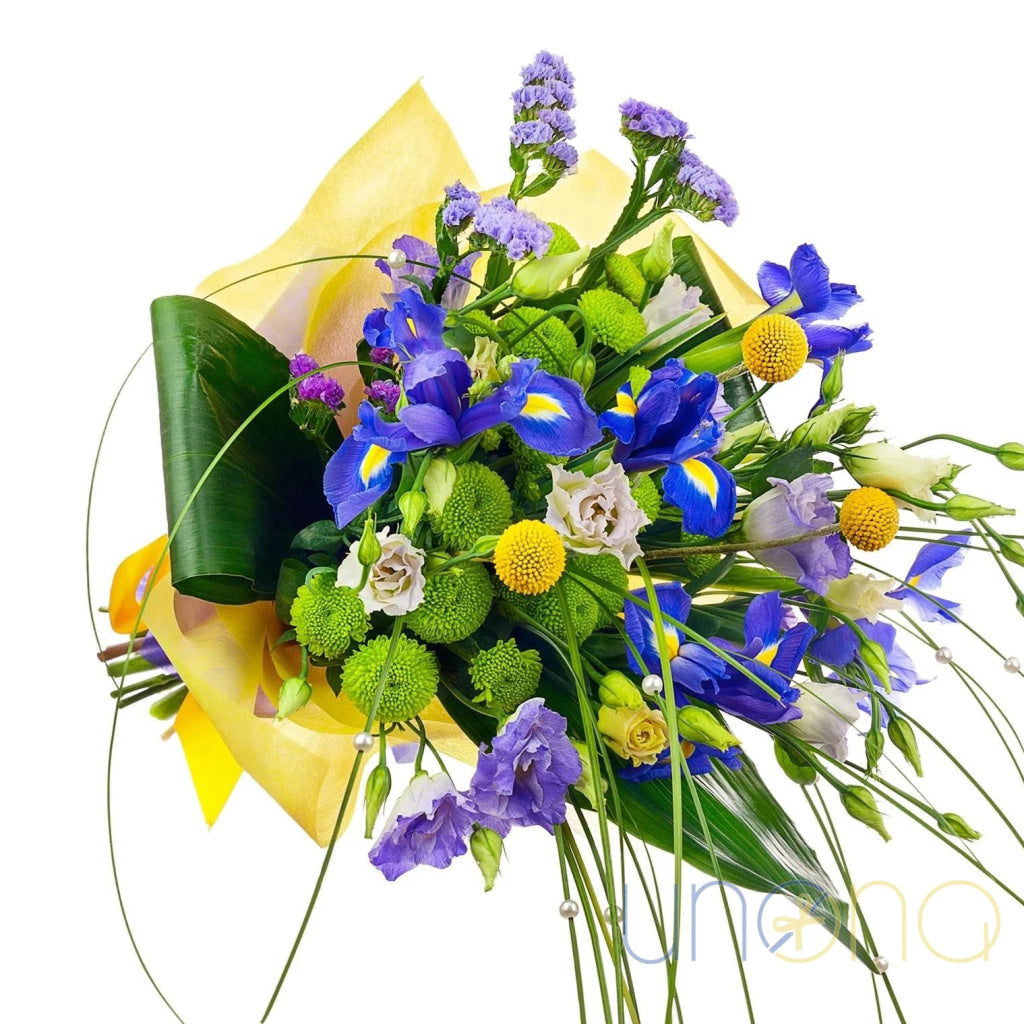 Blue iris and yellow flower bouquet with lisianthus and craspedia wrapped in elegant paper