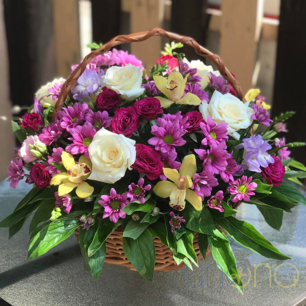 Romantic flower basket with roses orchids and chrysanthemums