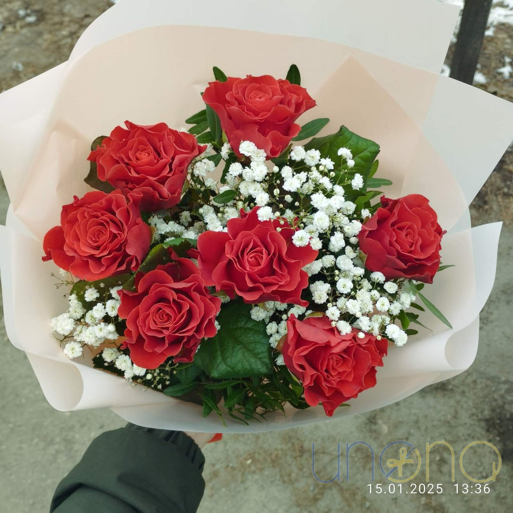 Romantic bouquet of 7 fresh roses hand delivered in Ukraine