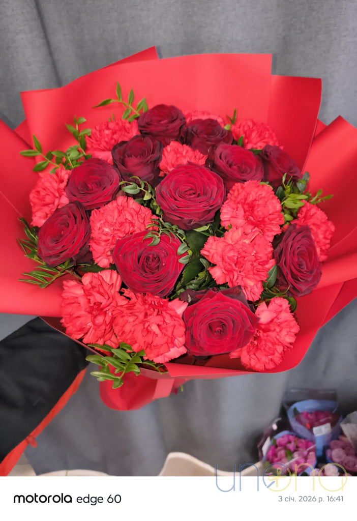 luxurious romantic bouquet with 9 red roses and 12 dark red carnations for delivery in Ukraine