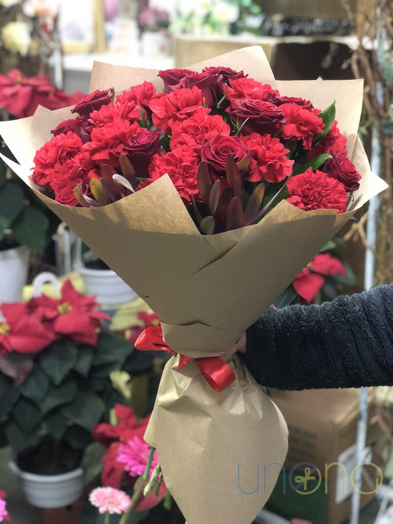Romantic bouquet of 9 red roses and 12 dark red carnations