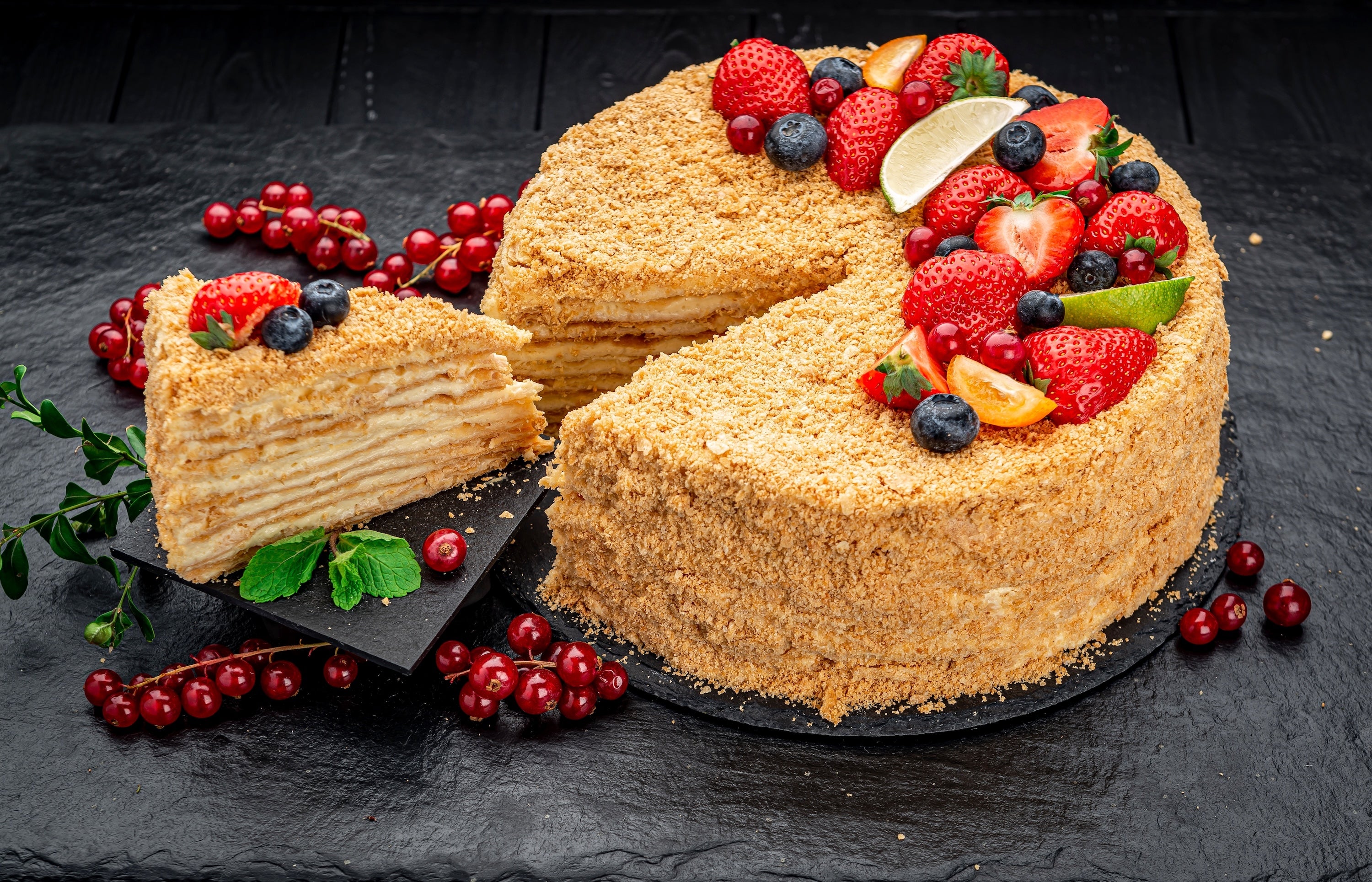 Classic French Napoleon Cake with flaky pastry layers, custard cream, and fresh seasonal berries