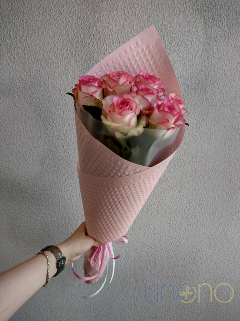 Romantic bouquet of 7 pink roses hand delivered in Kyiv