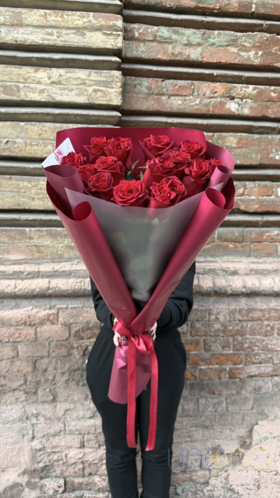 colorful bouquet of 15 red roses for flower delivery in Poltava Ukraine