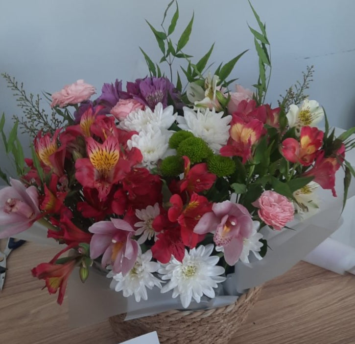 Romantic basket of fresh flowers for delivery in Ukraine