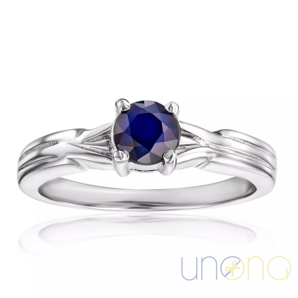 Romantic sterling silver ring with deep blue sapphire gemstone