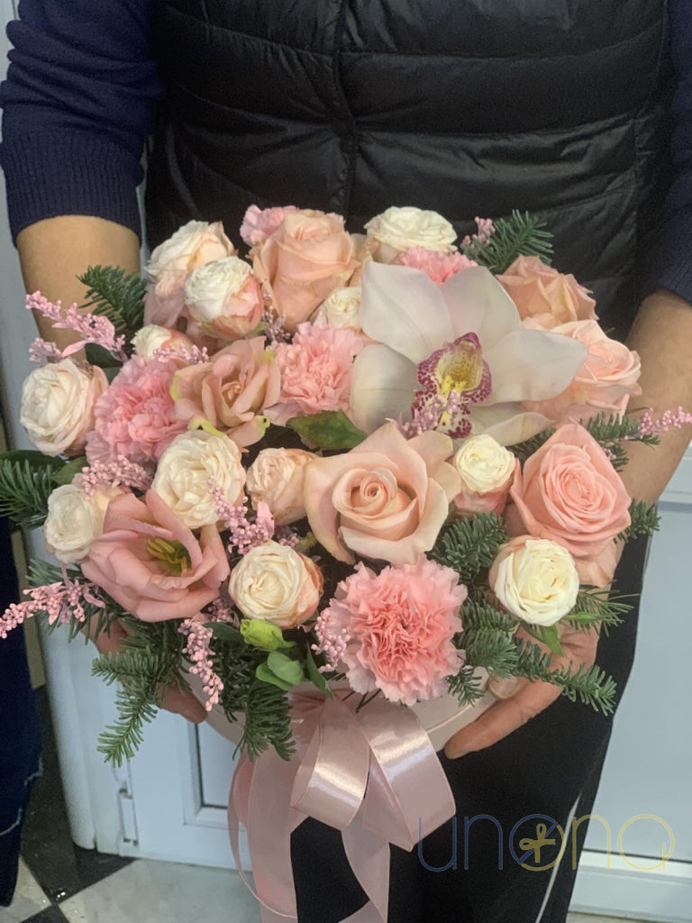 Pink orchid bloom as centerpiece in Snowy Chiffon Bouquet gift box