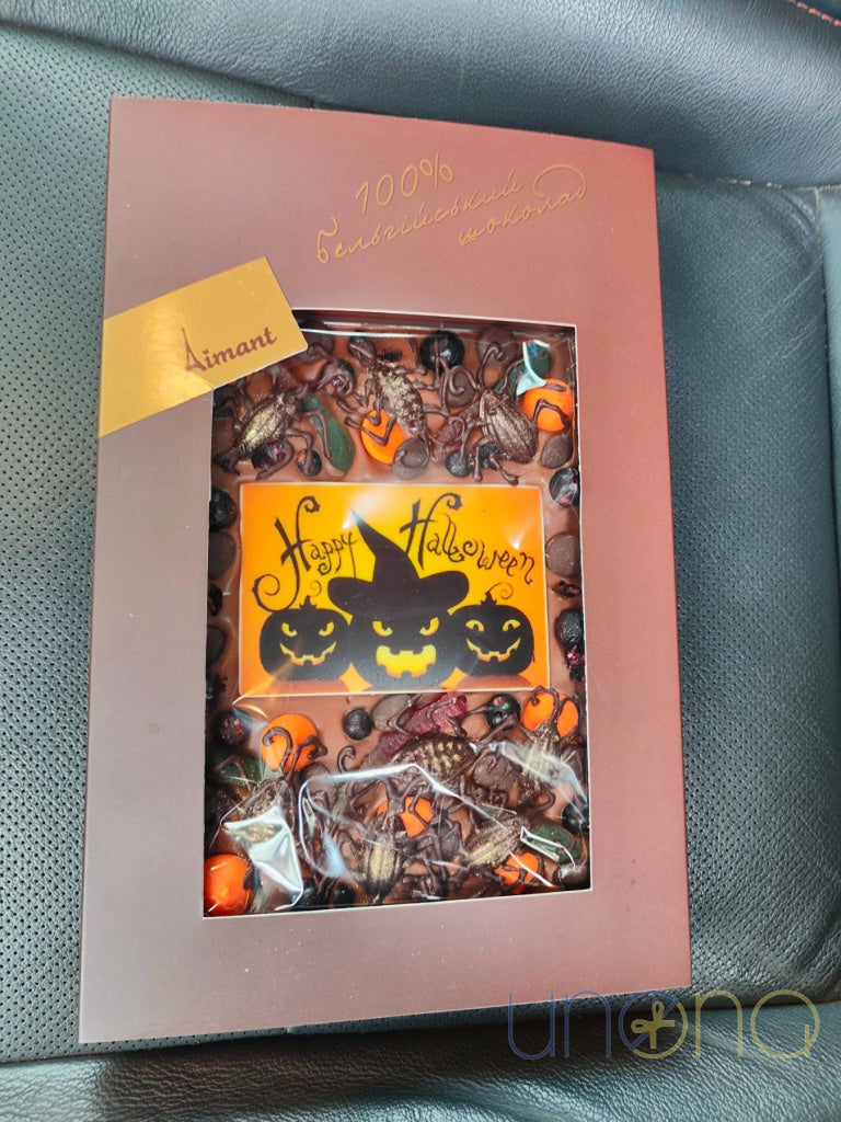 Spooky Halloween chocolate gift featuring Belgian milk chocolate, gummy worms, chocolate insects, and festive decorations