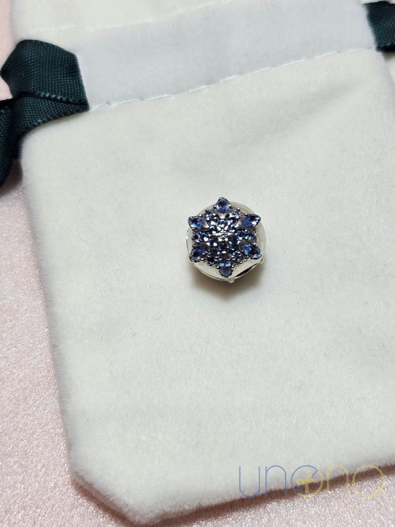 Silver charm with snowflake design and cubic zirconia