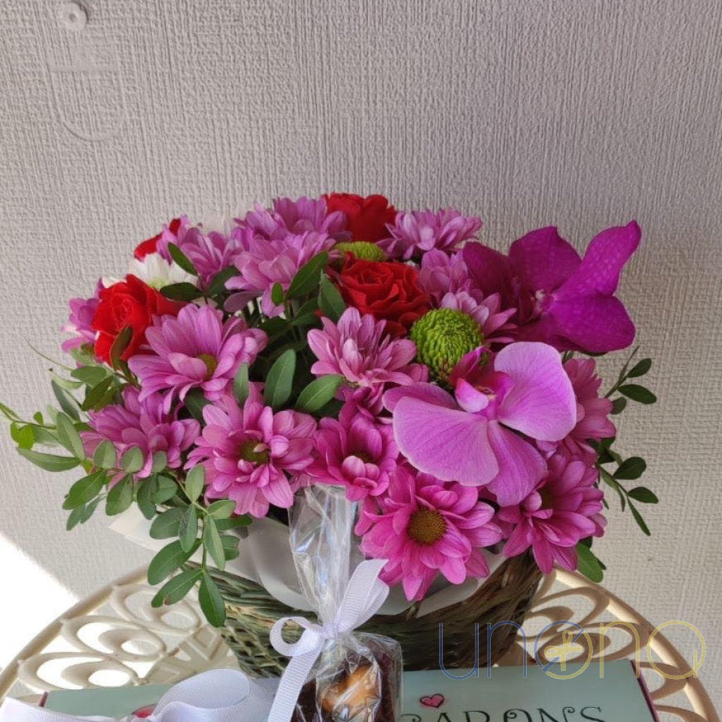 Roses, orchids and chrysanthemums flower basket for delivery in Ukraine