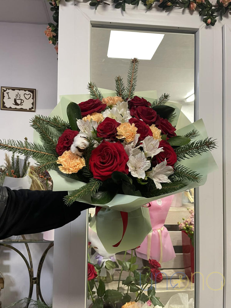 Red roses and bi-color carnations in winter bouquet
