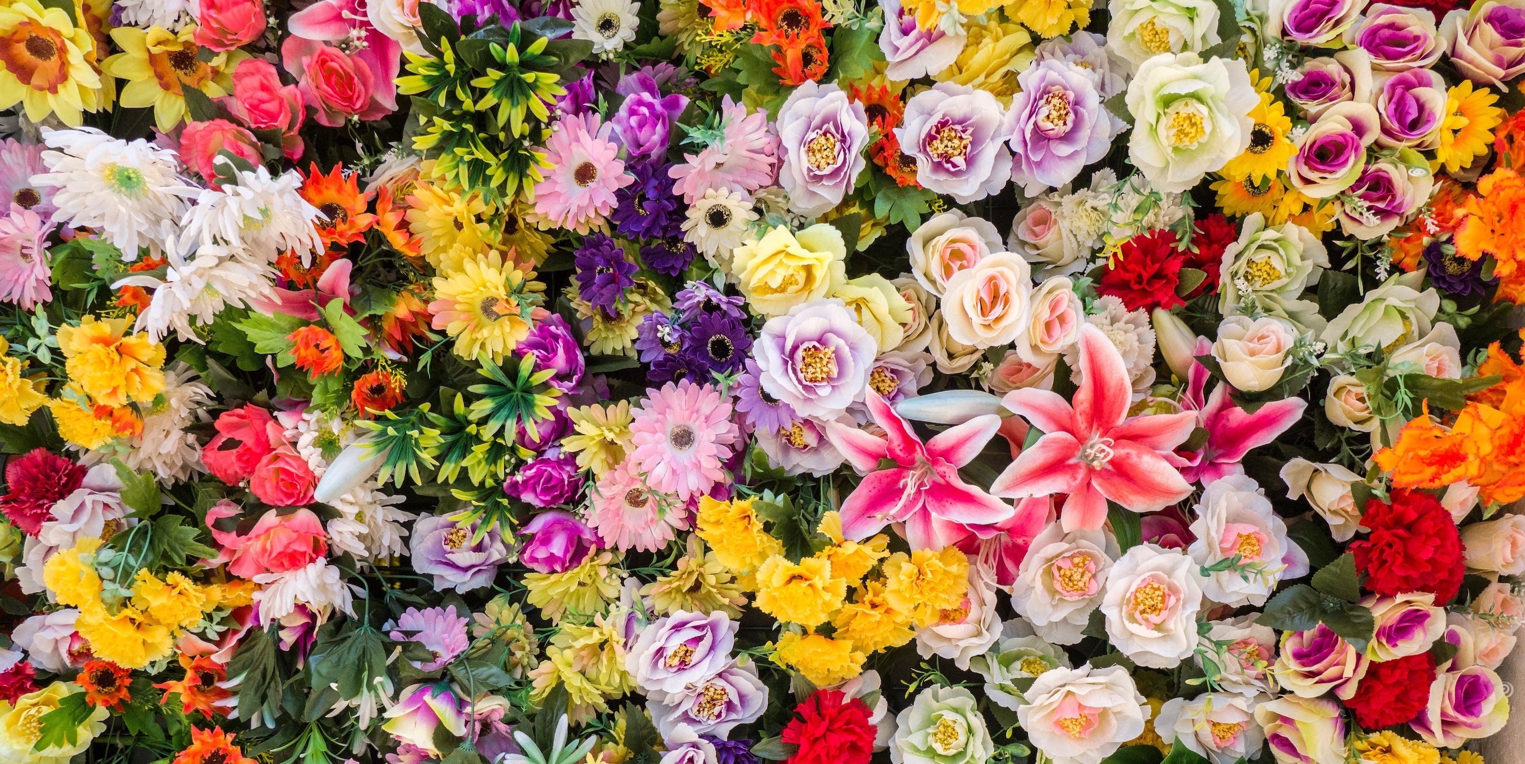 assorted flower bouquet with roses tulips and peonies symbolizing different meanings