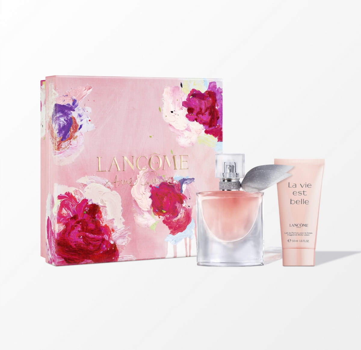 Lancôme La Vie Est Belle perfume, body lotion and shower gel beside a rose-patterned gift box