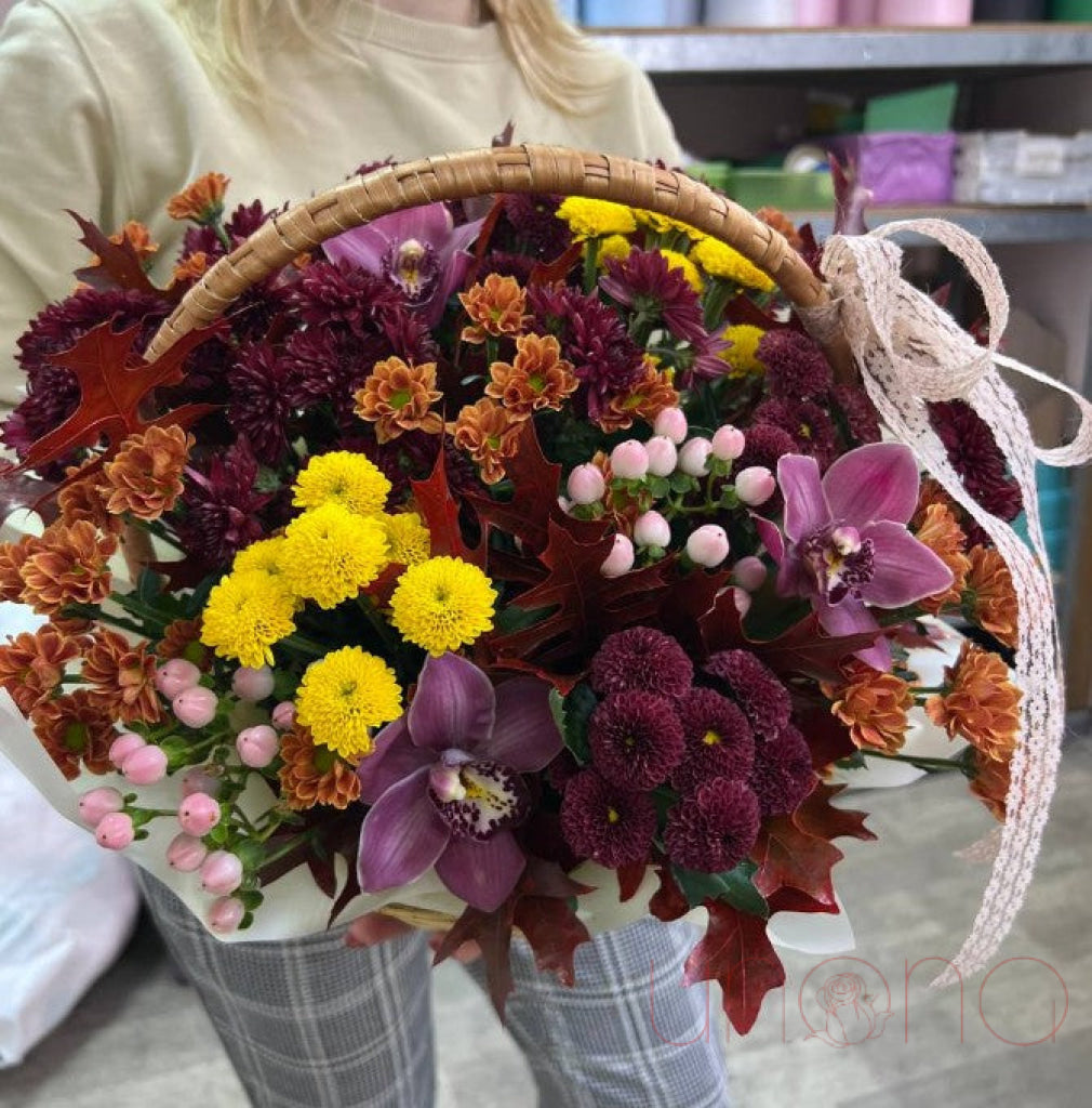 Autumn chrysanthemums arranged in a seasonal flower basket