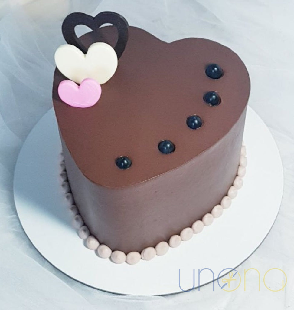 Heart-shaped birthday cake available in chocolate or strawberry flavor