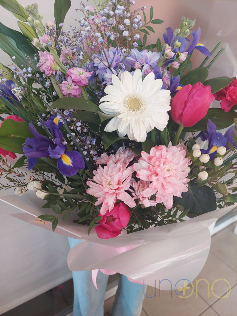 Pink and yellow chrysanthemums in cheerful flower arrangement