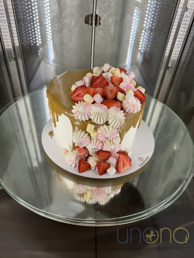 Celebration strawberry cake with mini marshmallows, buttercream kisses, and fresh strawberries
