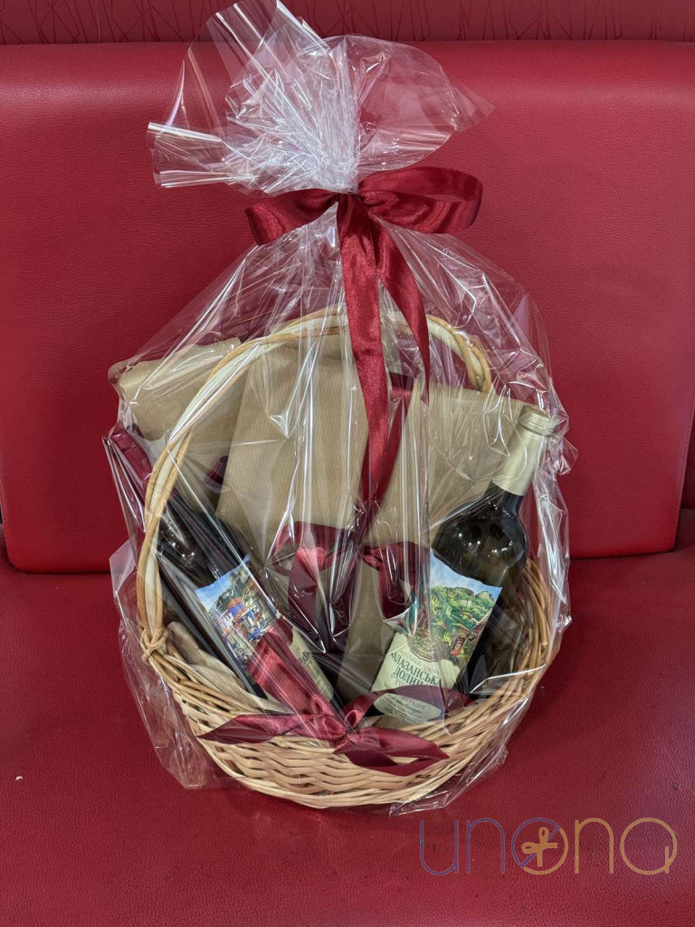 Celebration gift basket with fine wines, Raffaello chocolates and decorative bow