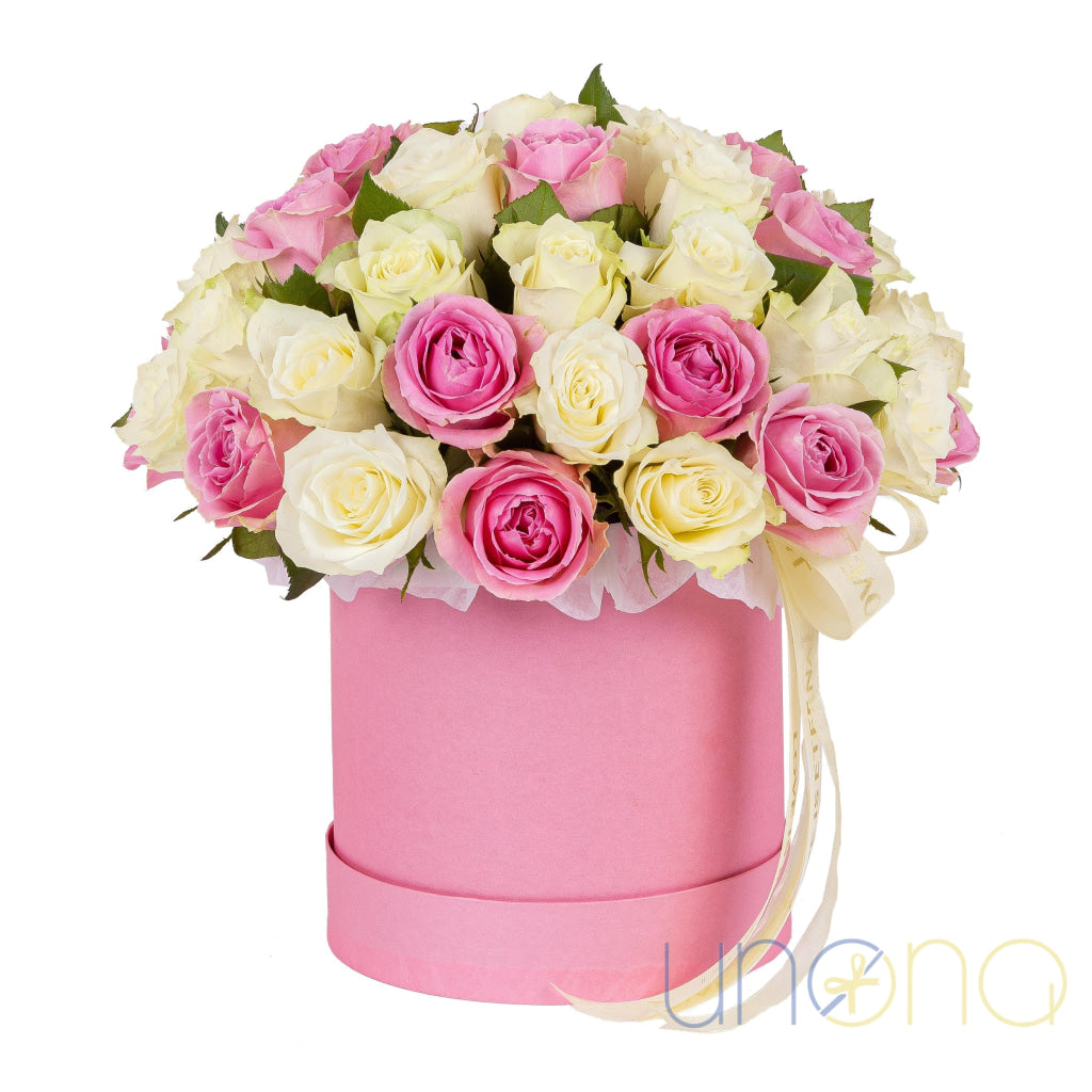 Pink and white roses in a pink hat box – roses delivery in Ukraine