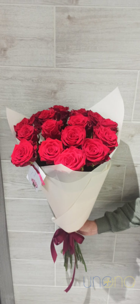 Elegant arrangement of 9 fabulous red roses delivered across Ukraine