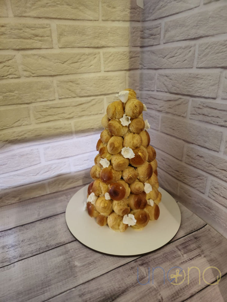 Traditional French Croquembouche with caramel-glazed profiteroles