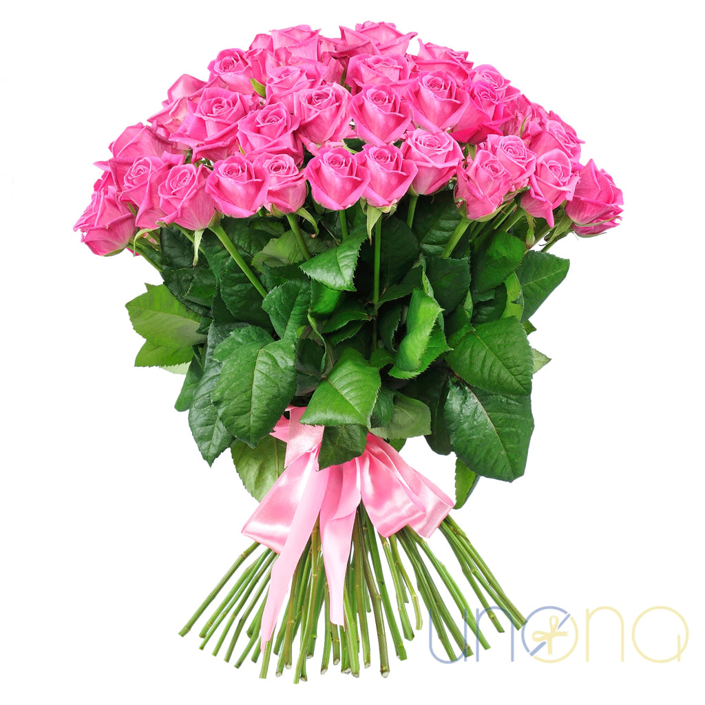 Large bouquet of 57 pink roses tied with pink ribbon – roses delivery in Ukraine