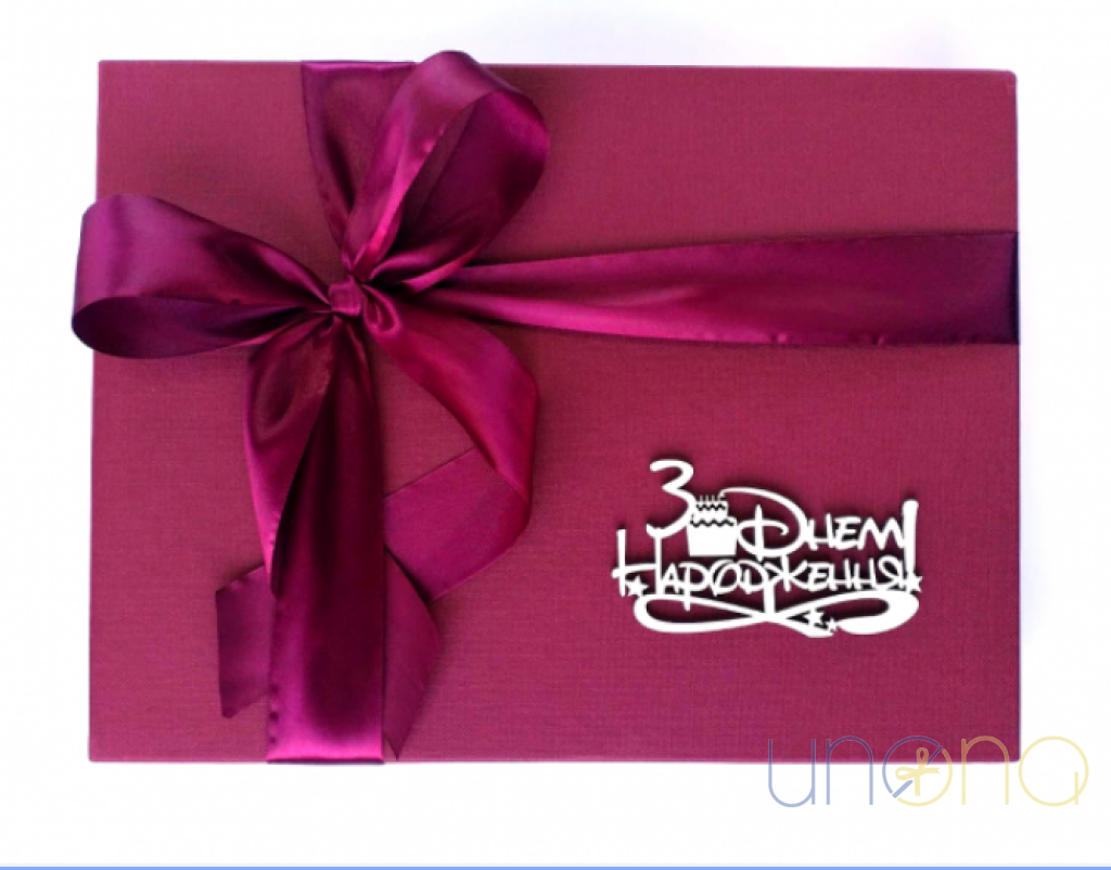 Elegant gourmet birthday gift set featuring Belgian chocolates, macarons, sparkling Martini Asti, and premium tea