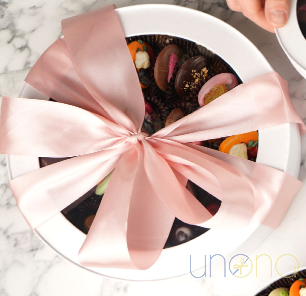 Gourmet mini Belgian chocolate gift featuring handcrafted artisan chocolates in an elegant round gift box