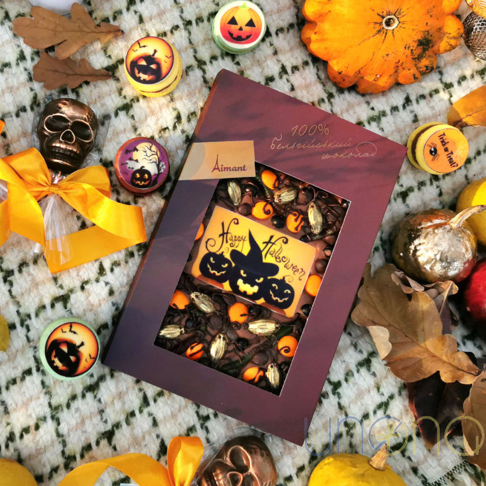 Handcrafted Belgian milk chocolate Halloween bar decorated with spooky candies and edible Happy Halloween plaque