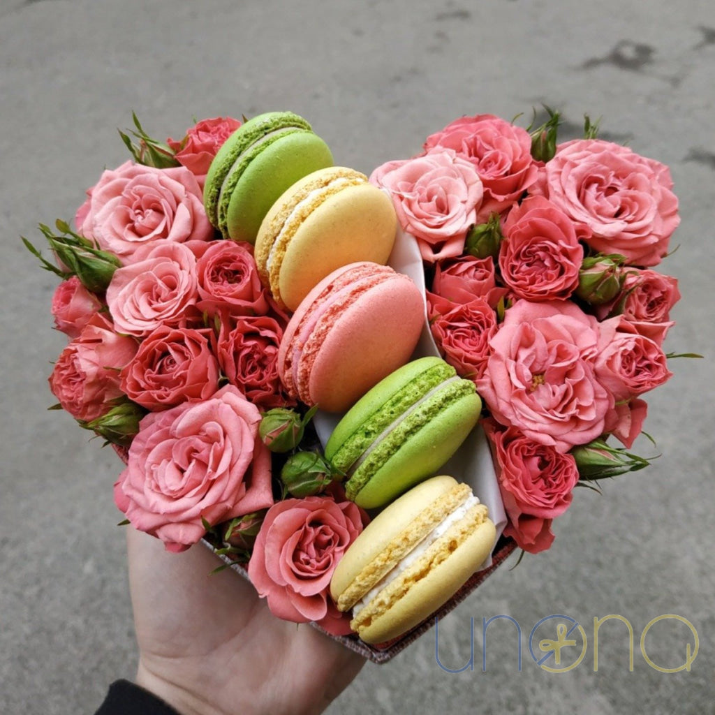 Heart-shaped arrangement with roses and artisan macarons
