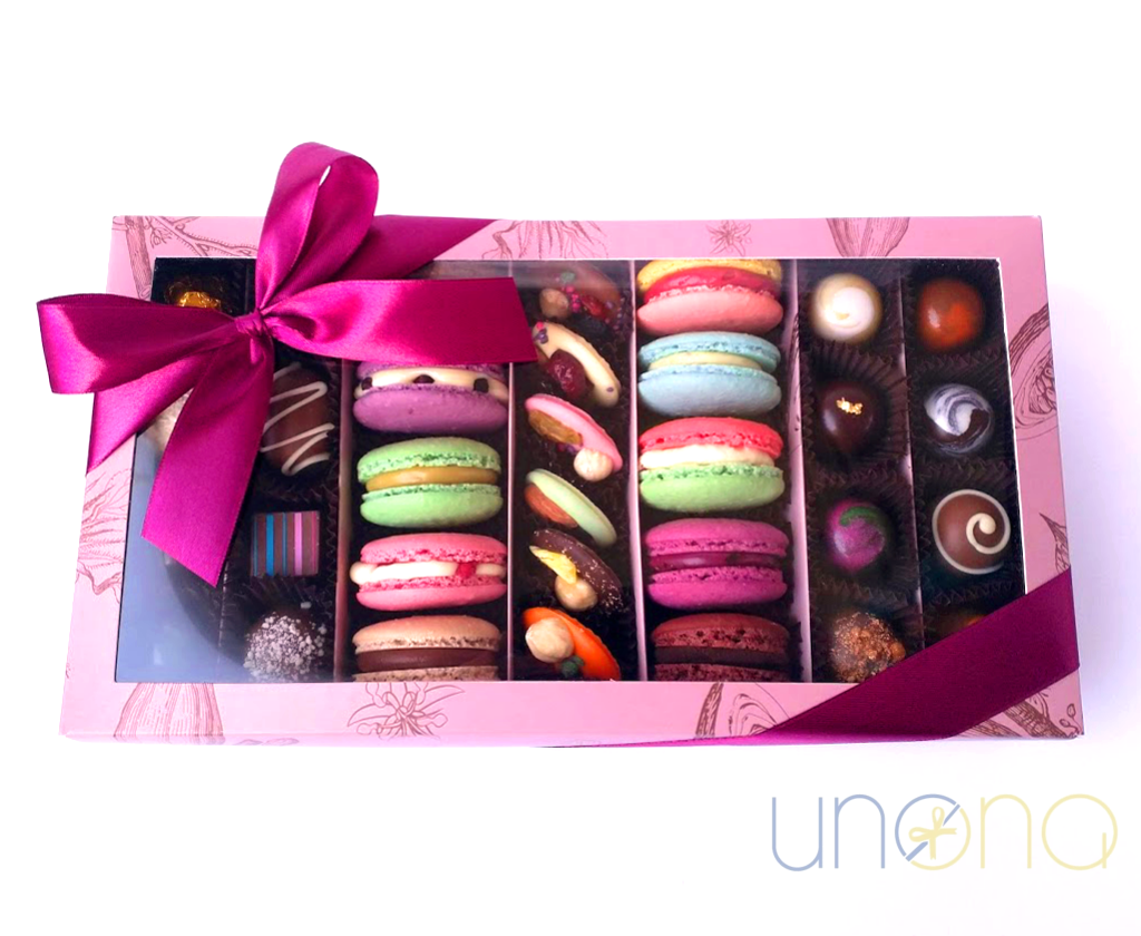 Luxury gift box with chocolates and fresh macarons