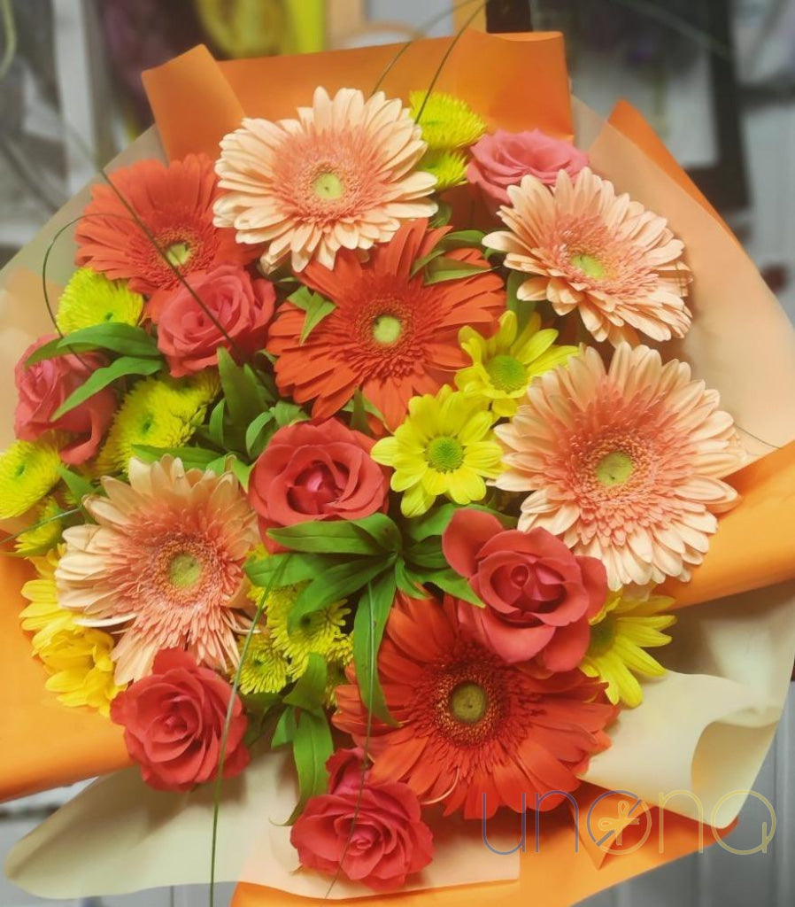 Hand-arranged orange autumn flowers delivered in Ukraine