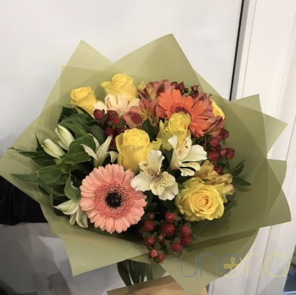 Warm orange flower bouquet with roses and alstroemerias