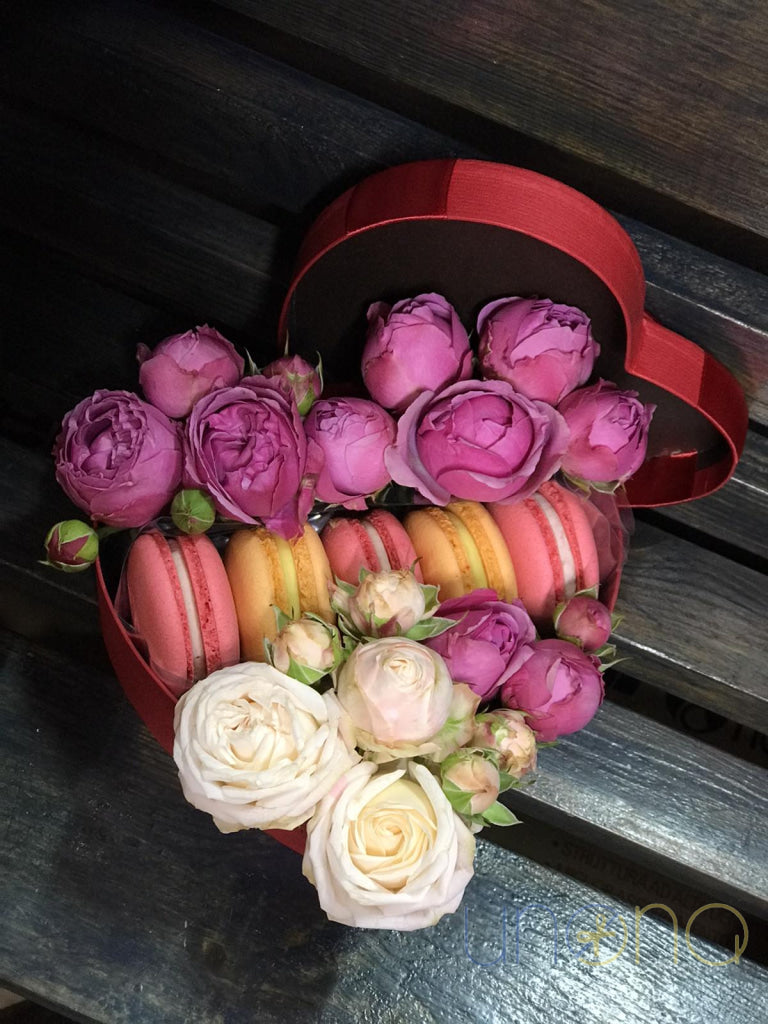 Pink roses and gourmet macarons gift arrangement