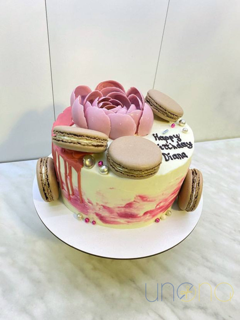 Premium celebration cake with berries and buttercream flowers