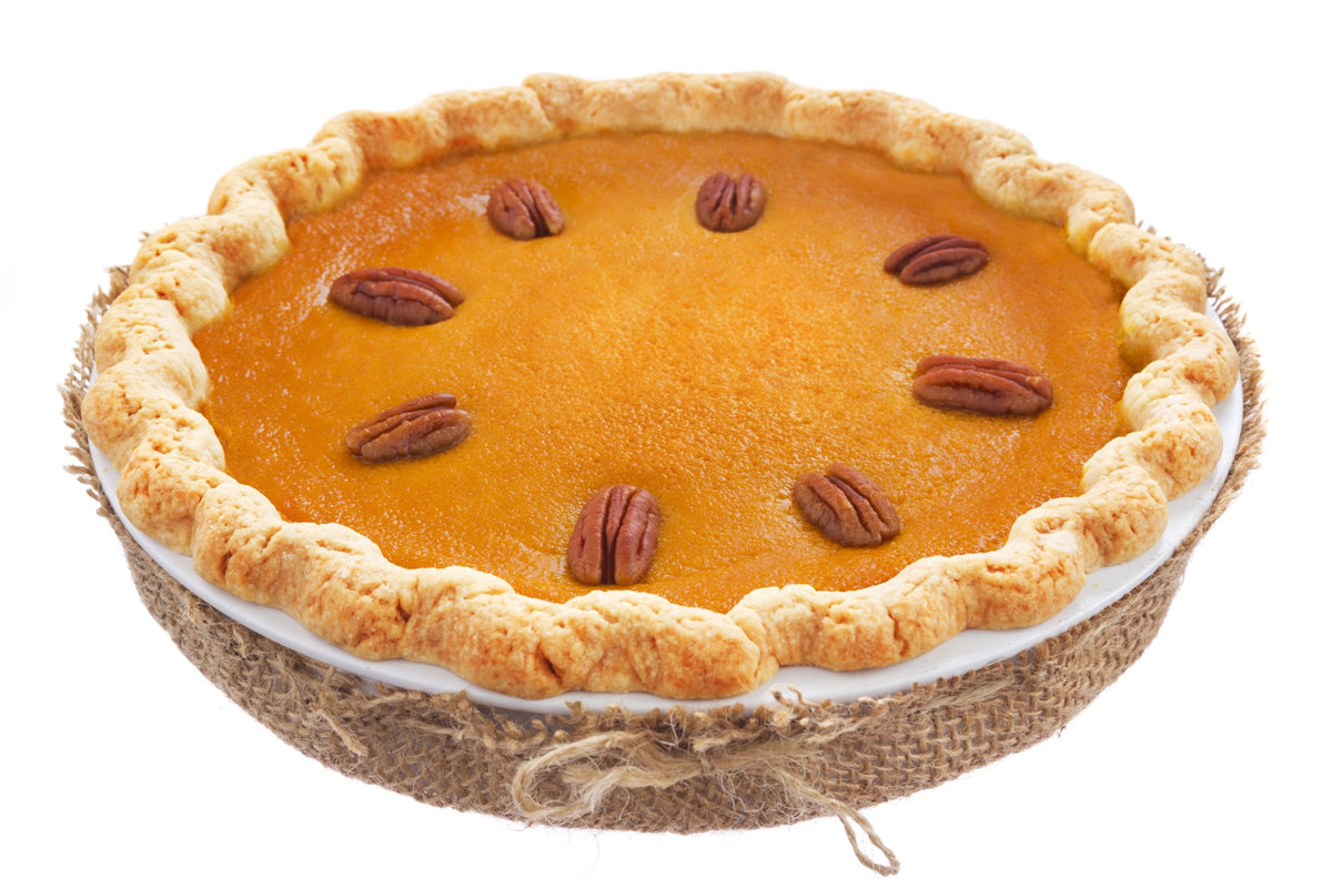 Classic pumpkin pie with buttery crust and pecan decoration