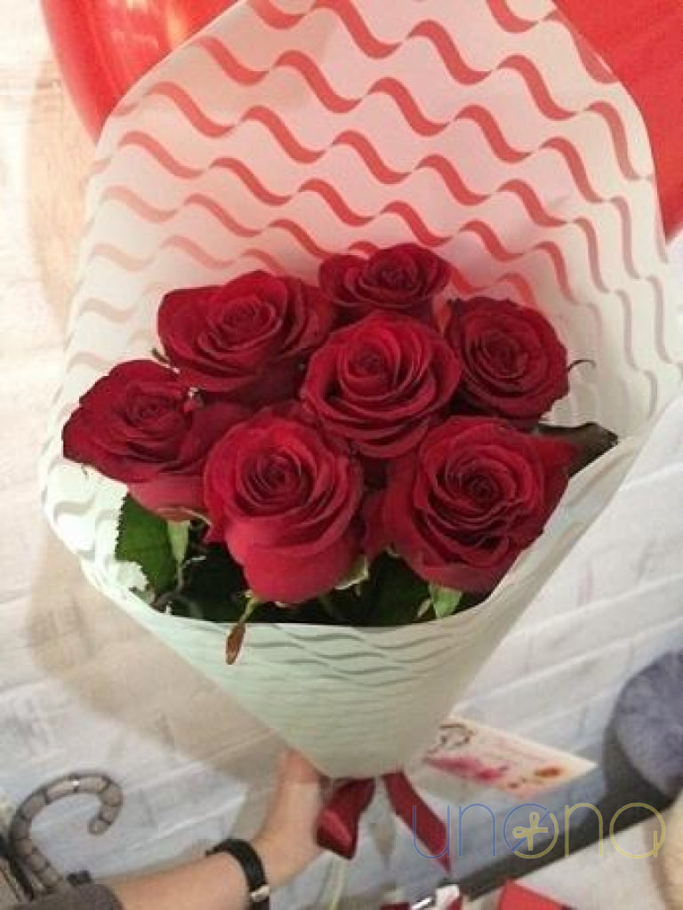 Romantic bouquet of 7 fresh roses hand delivered in Ukraine