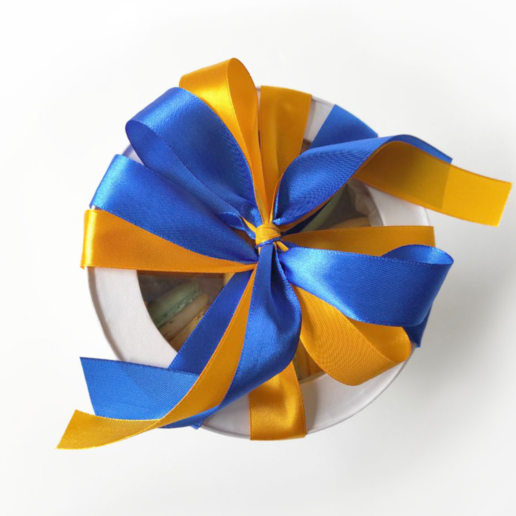 Patriotic Ukrainian macarons in blue and yellow colors with yellow and blue ribbons
