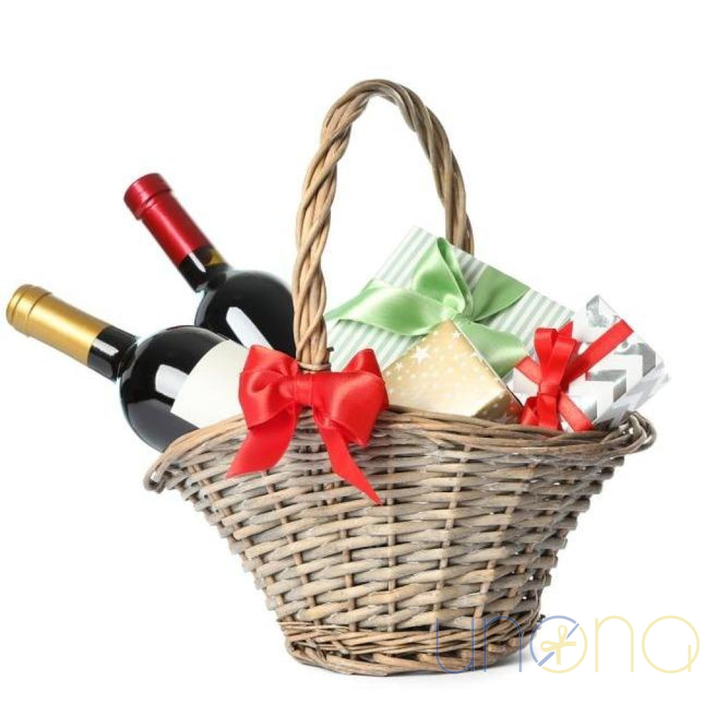 Sweet Gift Basket with Surprise featuring red wine, white wine, Ferrero Rocher, Raffaello and Kyiv Vechirny chocolates in a decorative wicker basket for delivery in Ukraine