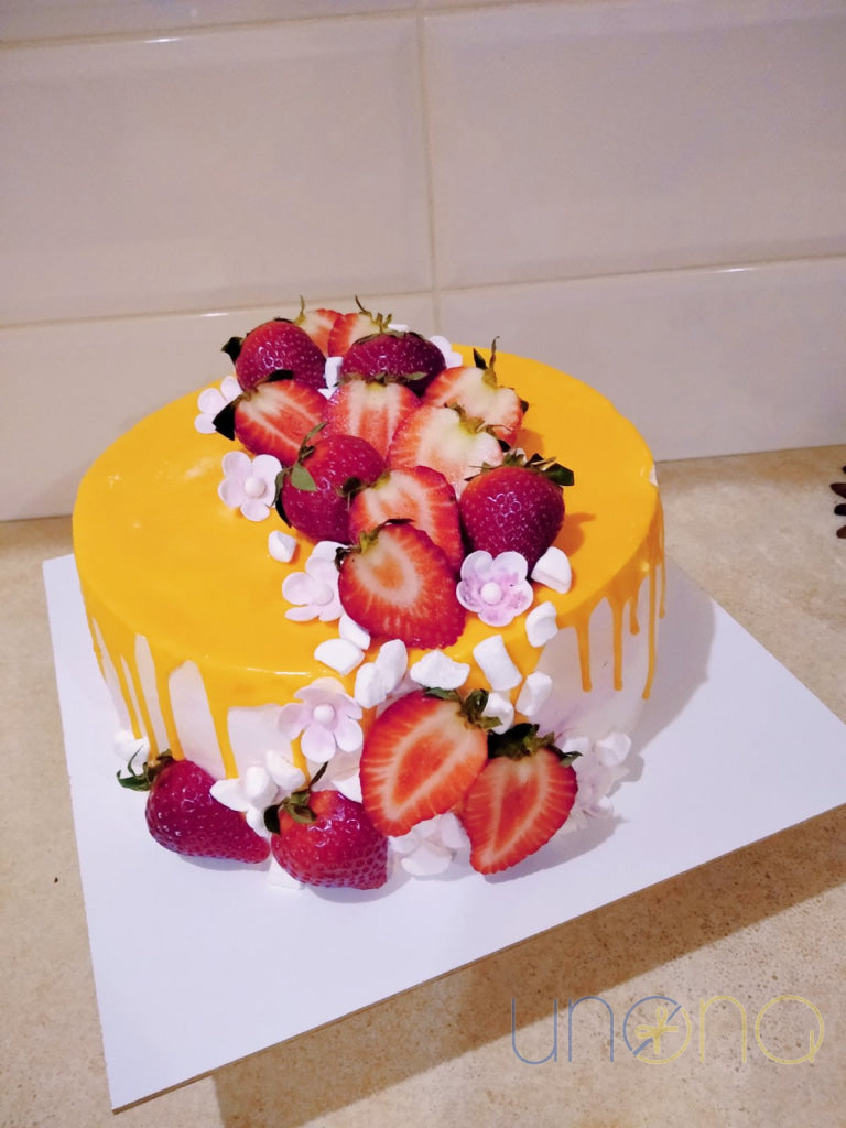 Vanilla sponge cake with whipped cream, strawberries, and handcrafted decoration
