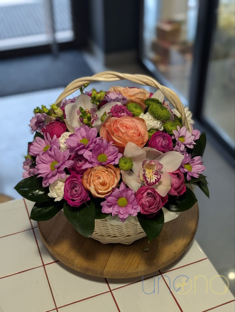Fresh flowers arranged in a natural wicker basket in Ukraine
