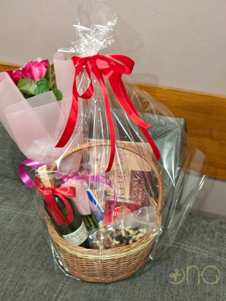 Elegant gift basket with wine, roses, Lindt chocolate and Roshen chocolates